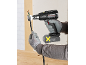 Cordless heat gun with battery, used for insulating an electrical cable.