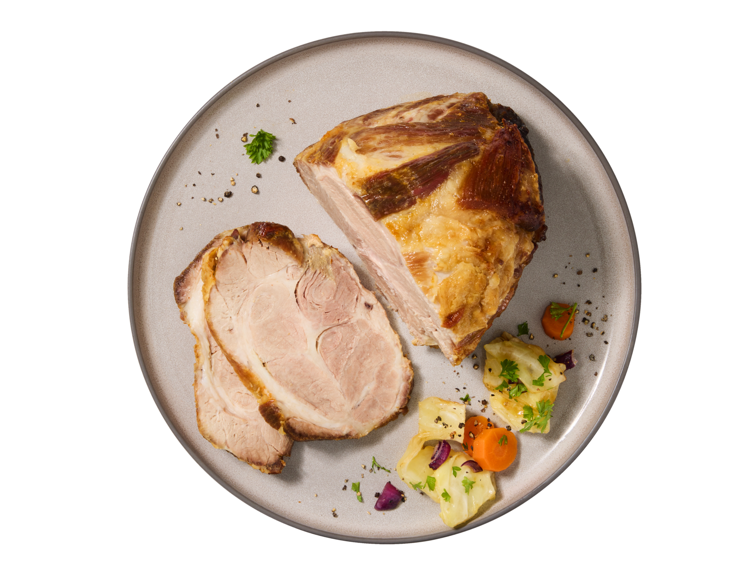 Roasted pork shoulder with sliced meat and vegetables on a plate.