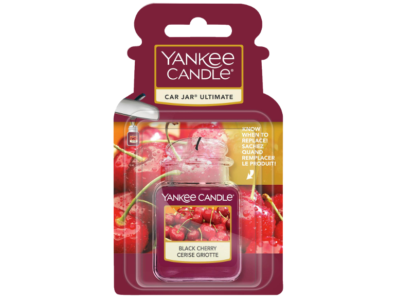 Car air freshener in the shape of a mini candle jar, black cherry scent.