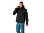Man in a black hooded softshell jacket and blue outdoor trousers