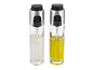 Two glass oil spray bottles with silver and black caps, one with clear liquid and one yellow.