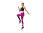 Woman in black sports top and pink marble-patterned leggings, running.