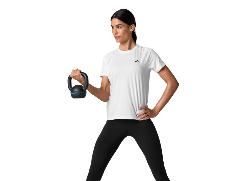 Woman in white sports t-shirt and black leggings, holding a kettlebell.