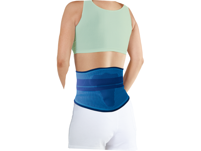 Woman wearing a blue lumbar support belt and a light green sports top.