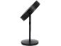 Black cosmetic mirror with a round base and adjustable stand.