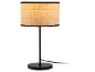 Table lamp with a black base and a beige paper shade.