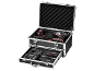 Power tool set in an open metal case with a pull-out drawer.