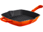 Orange square cast iron grill pan with a ridged bottom and a handle.