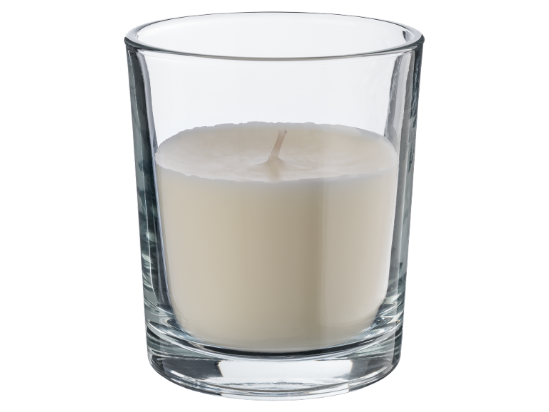 White candle in a clear glass tumbler.