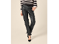 Woman in striped sweater and black faux leather trousers with heels.