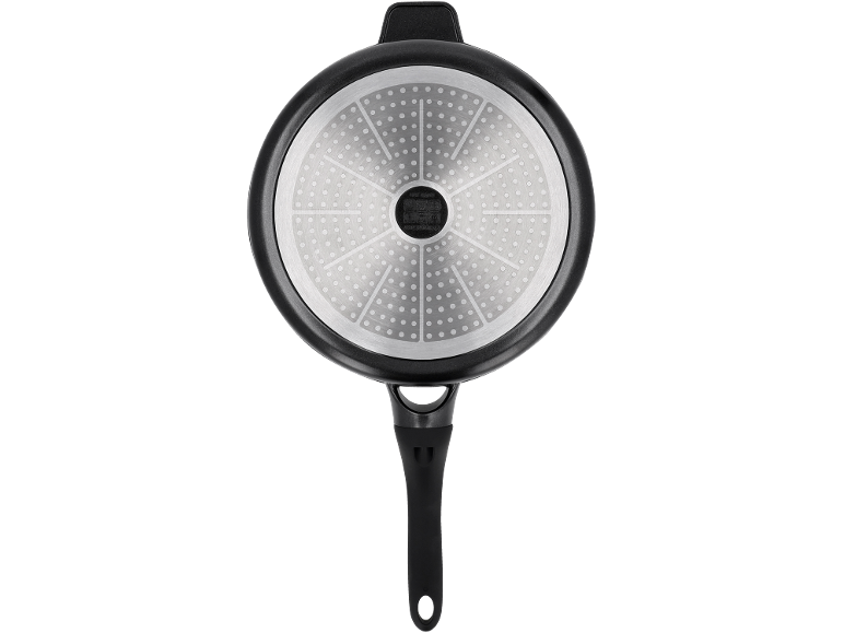 Bottom of a frying pan with a handle and an induction base with a dotted pattern.