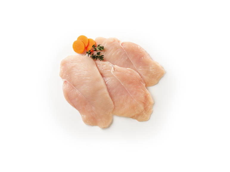 Raw chicken breast with carrot and thyme on a white background.