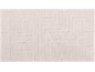 Light-colored bath mat with an embossed geometric pattern.