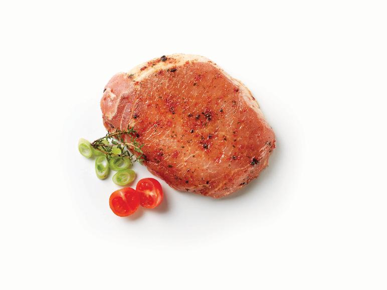 Seasoned pork chop with spring onions and cherry tomatoes