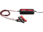 Car battery charger with red and black clamps and a digital display.
