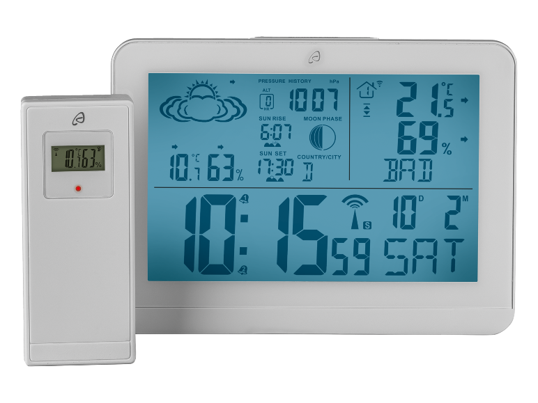 Digital weather station with outdoor sensor displaying temperature, humidity, pressure, time, and date.