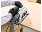 Person using a circular saw with a dust extraction system on a wooden board.