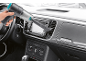 Cordless handheld vacuum cleaner cleaning a car dashboard.