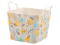 Beige flexible basket with handles and a pattern of yellow, blue leaves and dots.