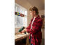 Man in a workshop using a heat gun on electrical wires.