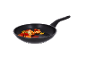 Frying pan with shrimp, cherry tomatoes, and herbs.