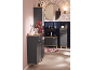 Modern bathroom with dark grey cabinets, wooden surfaces, and a round mirror.
