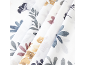 White fabric with a watercolor floral pattern in blue, gray, pink, and yellow tones.
