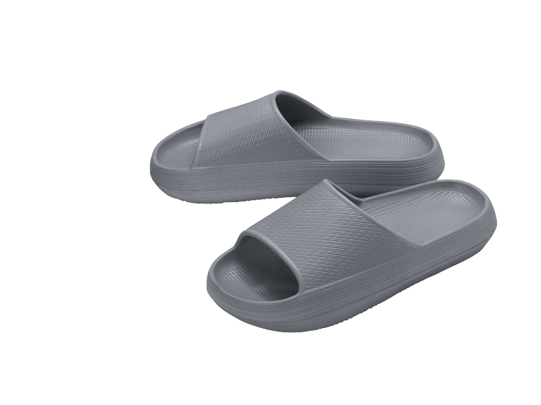 A pair of grey slide sandals with a thick sole and textured surface.