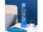 Blue decorative lamp with animated designs, next to a bed and a plant.