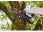 Person sawing a tree branch with a cordless chainsaw.