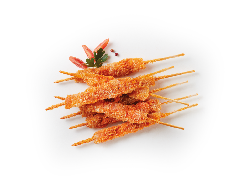 Crispy breaded chicken skewers, garnished with tomato and parsley.
