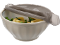Bowl with potatoes and green peas, with a strainer lid