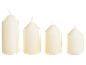 Four cream-colored wax candles of varying sizes, with white wicks, against a black background.