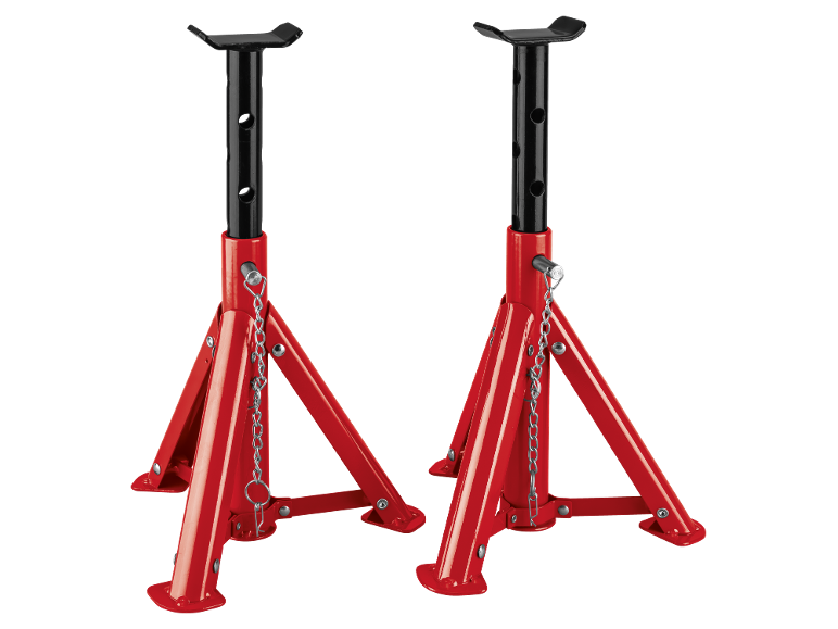 Pair of red car jack stands with black adjustable posts on a black background.