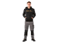 Man in black hoodie and grey work trousers.