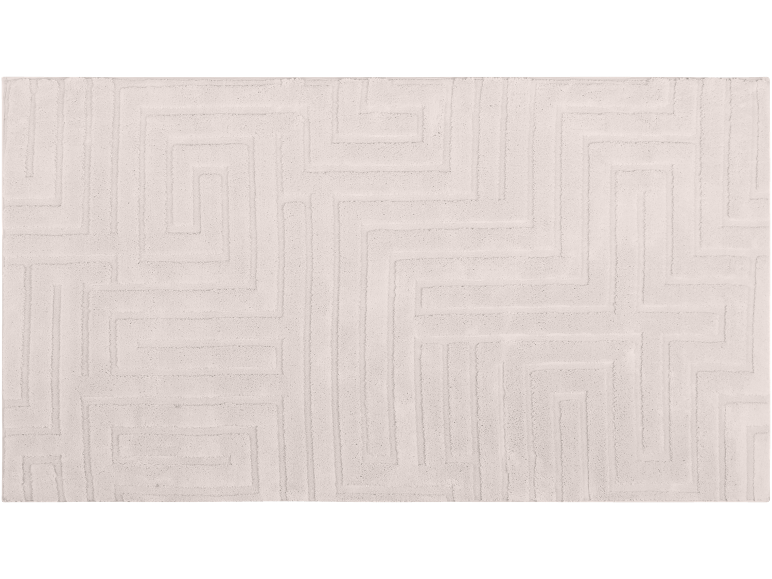 Light-colored bath mat with an embossed geometric pattern.