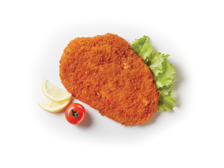 Breaded schnitzel with lettuce, lemon slices, and a cherry tomato.