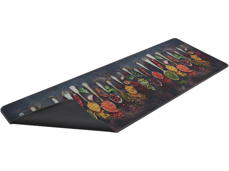 Kitchen mat with a design of spoons filled with various spices and herbs.