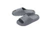 A pair of grey slide sandals with a thick sole and textured surface.