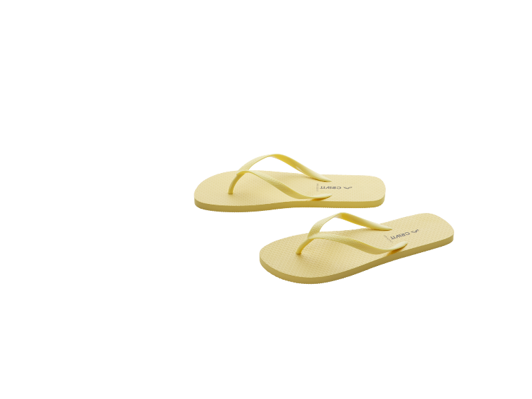 A pair of light yellow flip-flops with text on the sole.