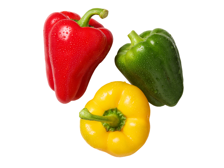 Red, green, and yellow bell peppers with water droplets on a black background.