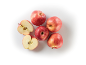 Red apples, whole and halved, on a white background.