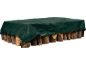 Green tarp protecting a stack of logs, secured with a rope.