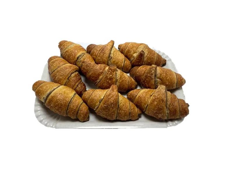 Chocolate croissants on a white tray.