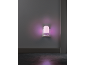 Purple night light plugged into a wall socket, illuminating a dark room.