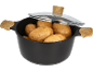 Black pot with wooden handles and a glass lid, filled with potatoes.