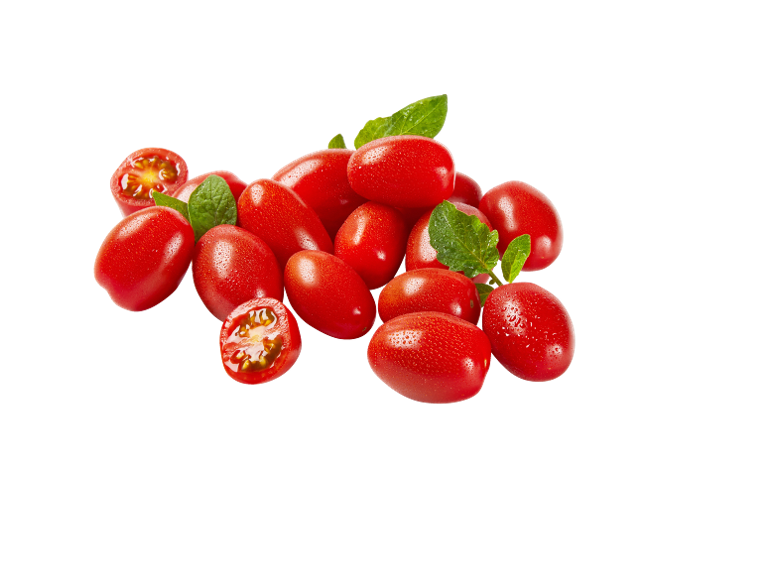 Fresh red cherry tomatoes with water droplets and green leaves.