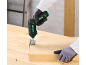 A green and black electric screwdriver screwing a hinge into a wooden board.