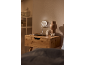 Night light with USB charger plugged into a wall socket, charging a power bank on a bedside table.