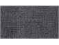 Dark grey rug with a raised geometric maze pattern.